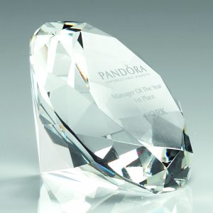 image showing the side of a DIA60 diamond paperweight with a corporate logo engraved on grey background.