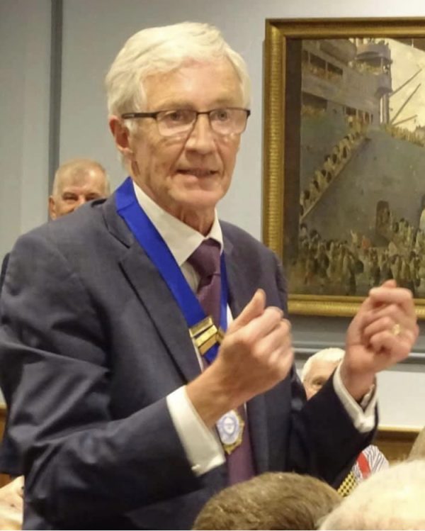 image showing Paul O'Grady wearing our medal bar on a ceremonial ribbon.
