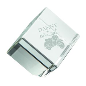 Image showing glass cube paperweight with example engraving for a retirement gift.