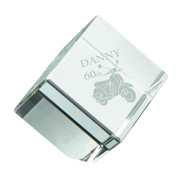Image showing glass cube paperweight with example engraving for a retirement gift.